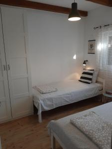 Posteľ alebo postele v izbe v ubytovaní Holiday house Barba - Vrana