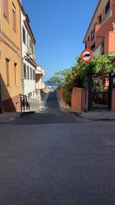 an empty street with a no parking sign on it at Casa Cristina in Alì Terme