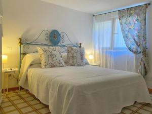 Ένα ή περισσότερα κρεβάτια σε δωμάτιο στο Da Rita