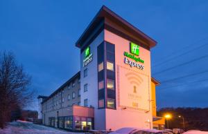 a hotel with a sign on the side of it at Holiday Inn Express Swindon West, an IHG Hotel in Swindon