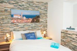Postel nebo postele na pokoji v ubytování Old Town Rooms Piran
