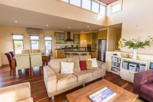 a living room with a couch and a table at Aqua Vista in Paynesville