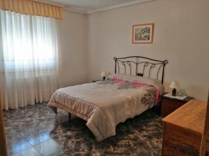 Postel nebo postele na pokoji v ubytování Casa Rural Amelia