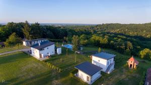 an aerial view of a house in a field at Kuće za odmor -Japin breg in Ðurđevac
