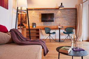TV a/nebo společenská místnost v ubytování Bio-Hotel Oswalda-Hus