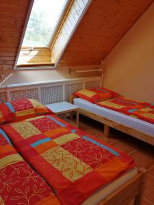 Posteľ alebo postele v izbe v ubytovaní Karpatia Panzio