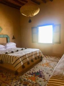 Cama o camas de una habitación en Kasbah Erg Chebbi