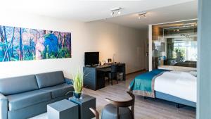 Rúm í herbergi á Abalona Hotel & Apartments