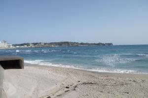 een zandstrand met de oceaan op de achtergrond bij Amami - Vacation STAY 83858 in Katsuura