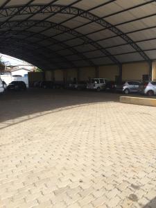 a large parking lot with cars parked in it at Perea Hotel in São Carlos