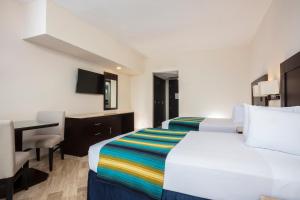 Postel nebo postele na pokoji v ubytování Crown Paradise Club Cancun - All Inclusive