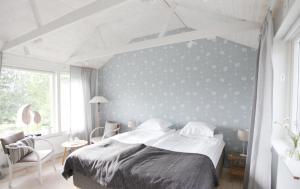 Una cama o camas en una habitación de Tuna Orangeri