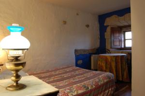 Giường trong phòng chung tại La Casona de Villanueva de Colombres