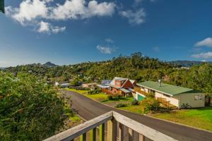 a view from the balcony of a house at Coastal Hill Retreat - Tairua Holiday Home in Tairua