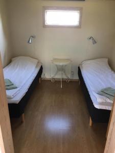 Postel nebo postele na pokoji v ubytování Borrby B&B