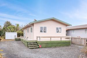 a house with a fence in front of it at Fifteen B - National Park Holiday Home in National Park