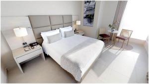 Una cama o camas en una habitación de Estelar Cartagena de Indias Hotel y Centro de Convenciones
