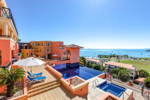 an aerial view of a house with a swimming pool at Martinique Whitsunday Resort in Airlie Beach