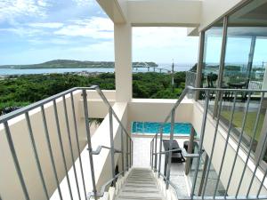 a view from the balcony of a house at KEN KEN VILLA YUUMODORO in Motobu