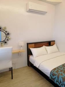 Un pat sau paturi într-o cameră la Yue Ya Wan Homestay