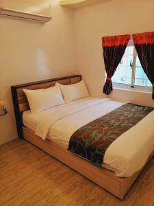 Postel nebo postele na pokoji v ubytování Yue Ya Wan Homestay