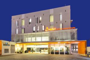 a building with a sign on the front of it at J Hotel - Bandara Soekarno Hatta in Tangerang