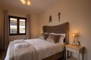 Postel nebo postele na pokoji v ubytování Byzantio Hotel & Apartments