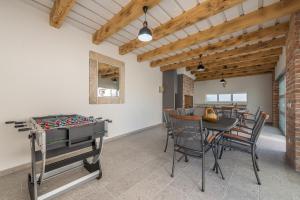 a dining room with a table and a chessboard at VILLA SOFIJA in Zaton