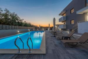 a swimming pool on the side of a building at VILLA SOFIJA in Zaton