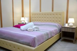Un pat sau paturi într-o cameră la Rosa Vesuviana