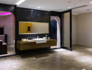 a bathroom with a sink and a mirror at All-Ur Boutique Motel - Taichung Branch in Taichung