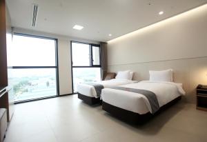 Postelja oz. postelje v sobi nastanitve Hotel Skypark DaejeonⅠ