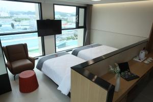 Postelja oz. postelje v sobi nastanitve Hotel Skypark DaejeonⅠ