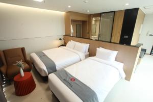 Postelja oz. postelje v sobi nastanitve Hotel Skypark DaejeonⅠ