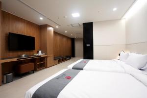 Postelja oz. postelje v sobi nastanitve Hotel Skypark DaejeonⅠ