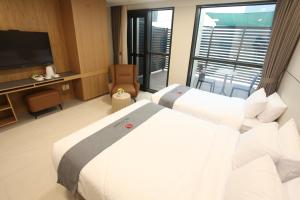 Postelja oz. postelje v sobi nastanitve Hotel Skypark DaejeonⅠ