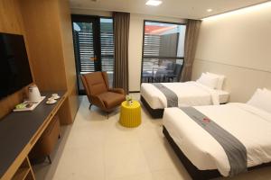 TV in/ali zabaviščno središče v nastanitvi Hotel Skypark DaejeonⅠ