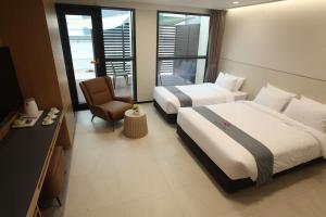 Postelja oz. postelje v sobi nastanitve Hotel Skypark DaejeonⅠ