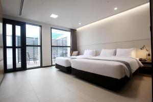 Postelja oz. postelje v sobi nastanitve Hotel Skypark DaejeonⅠ