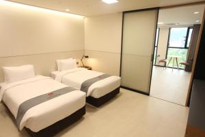 Postelja oz. postelje v sobi nastanitve Hotel Skypark DaejeonⅠ