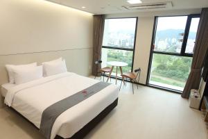 Postelja oz. postelje v sobi nastanitve Hotel Skypark DaejeonⅠ