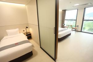 Postelja oz. postelje v sobi nastanitve Hotel Skypark DaejeonⅠ