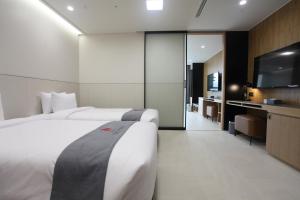 Postelja oz. postelje v sobi nastanitve Hotel Skypark DaejeonⅠ