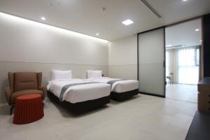 Postelja oz. postelje v sobi nastanitve Hotel Skypark DaejeonⅠ