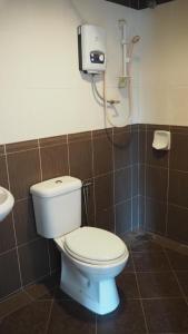 a bathroom with a toilet and a shower at 906 Hotel Melaka Raya in Malacca