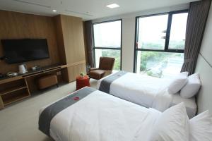 Postelja oz. postelje v sobi nastanitve Hotel Skypark DaejeonⅠ