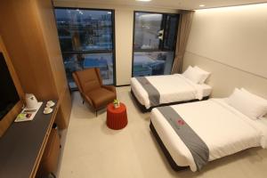 Postelja oz. postelje v sobi nastanitve Hotel Skypark DaejeonⅠ