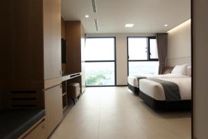 Postelja oz. postelje v sobi nastanitve Hotel Skypark DaejeonⅠ