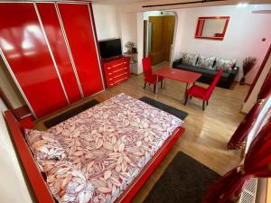a bedroom with a bed and a living room at Faleză nord in Constanţa