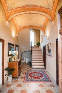 an ornate hallway with a staircase and a ceiling at Villa Mascitti B&B Tortoreto Alto in Tortoreto Lido